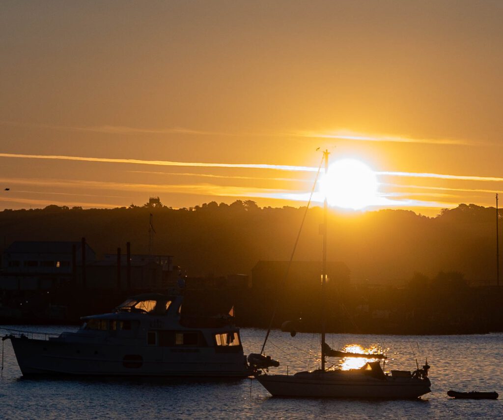 A boat ready to sail at dawn in Falmouth Harbour